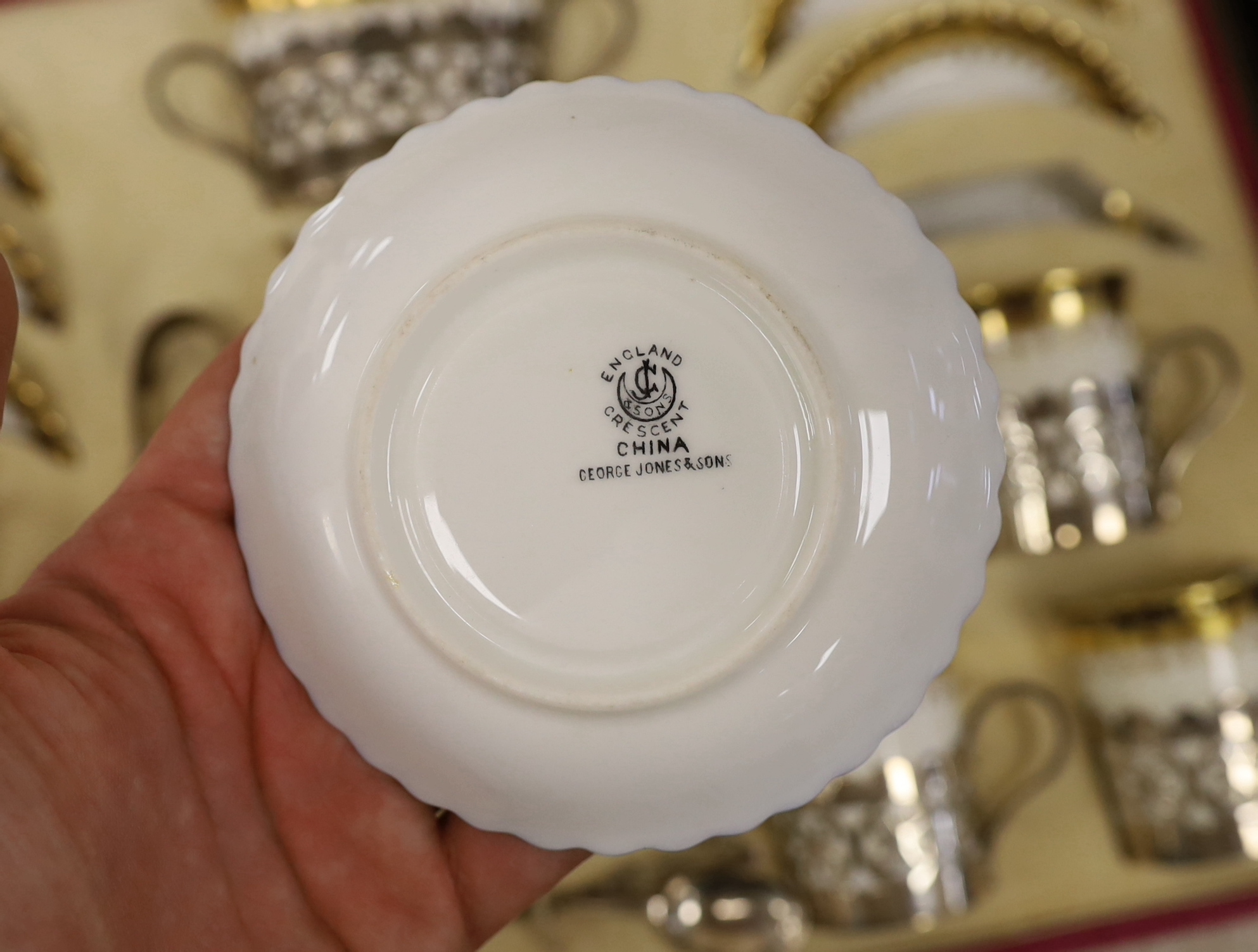 A cased George Jones Crescent China silver mounted coffee set, marks for Alexander Clark Co Ltd Sheffield 1928